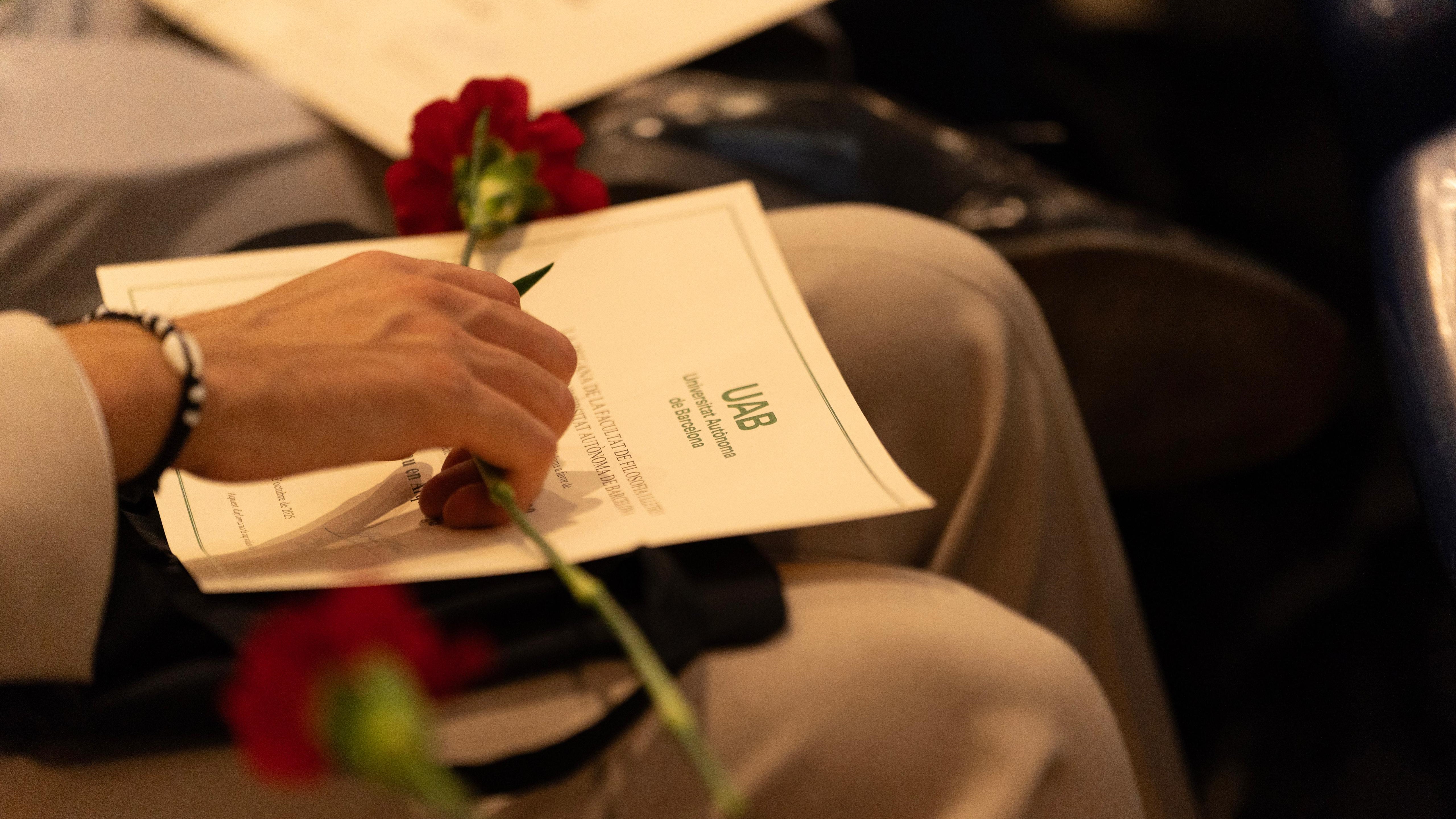 Diploma amb una rosa